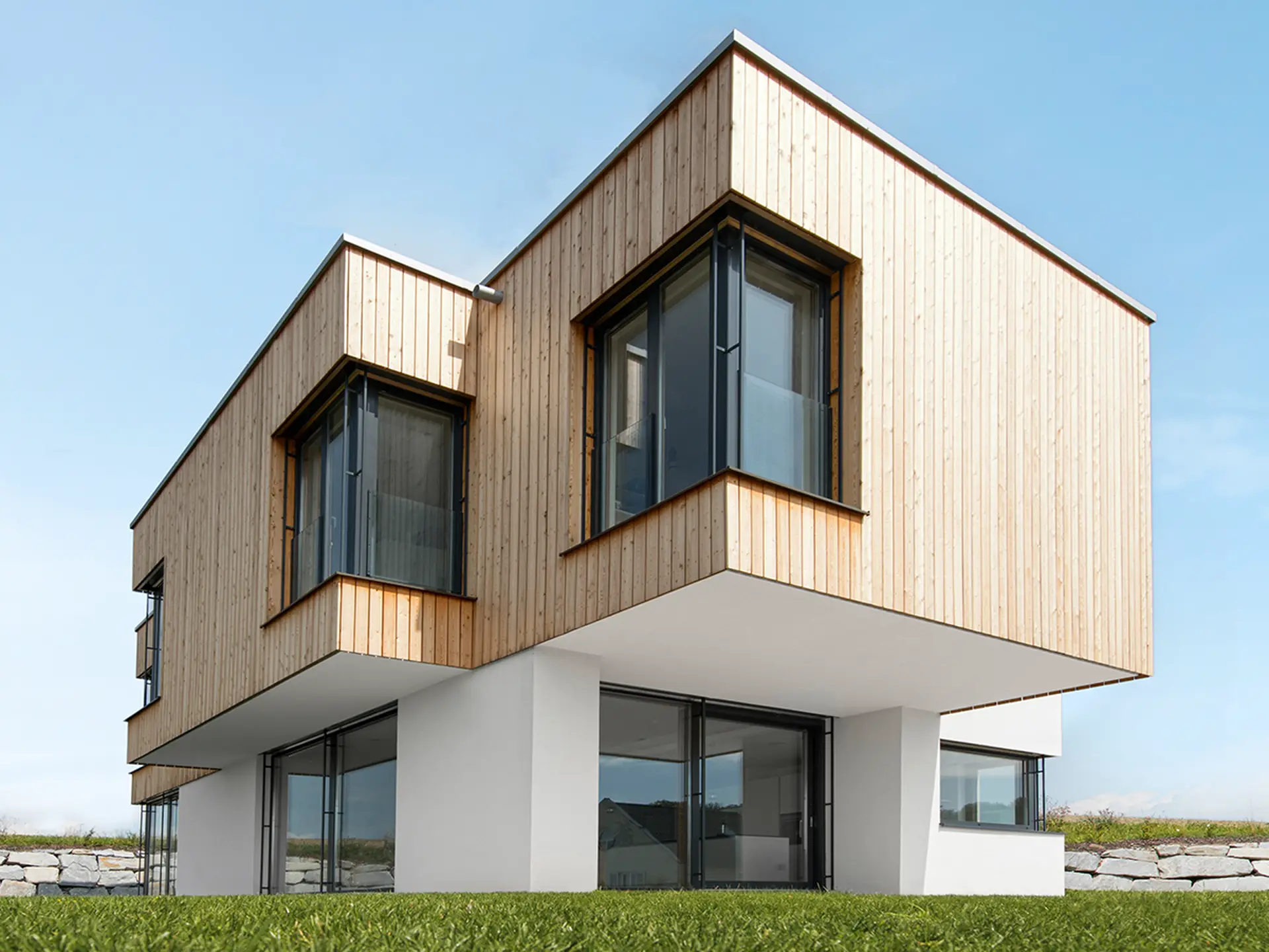 Dark aluminium cladding against timber. Image: Internorm.